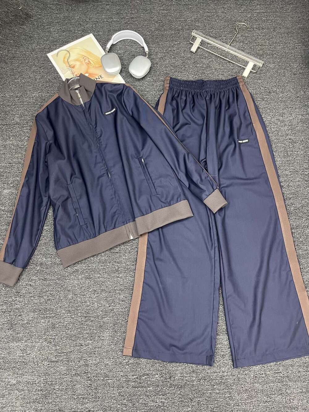 Miu Miu navy blue zipper jacket with wide-leg pants and sports outfit